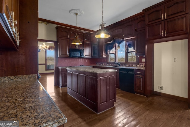 kitchen with plenty of natural light, black appliances, dark wood-type flooring, and a sink