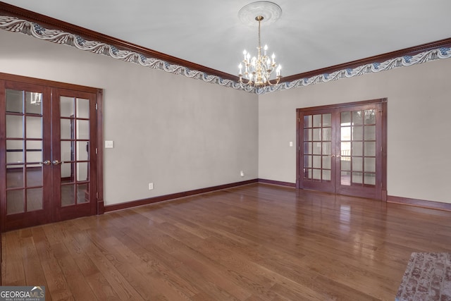 unfurnished room featuring french doors, wood finished floors, and crown molding