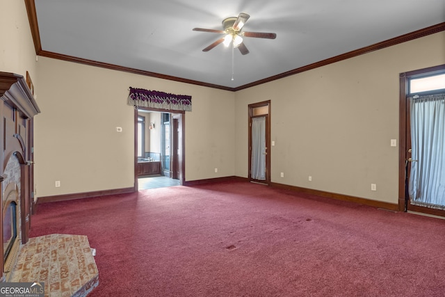 unfurnished living room with ornamental molding, a ceiling fan, baseboards, and carpet floors