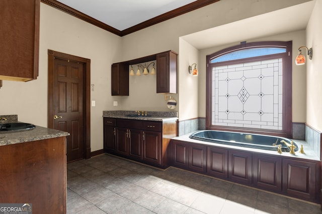 full bath featuring tile patterned floors, a garden tub, ornamental molding, and vanity