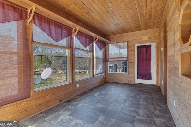 unfurnished sunroom with wood ceiling