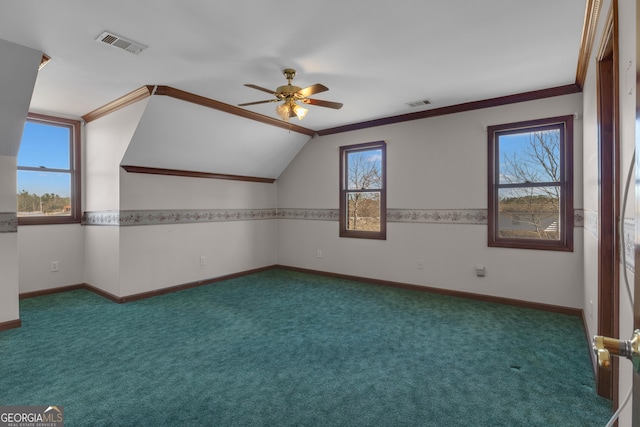 additional living space featuring visible vents, carpet floors, baseboards, and a ceiling fan