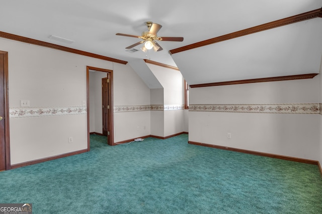 additional living space with visible vents, baseboards, carpet floors, ceiling fan, and vaulted ceiling