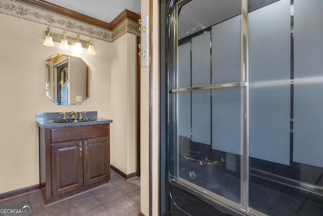 bathroom featuring tile patterned floors, baseboards, and vanity