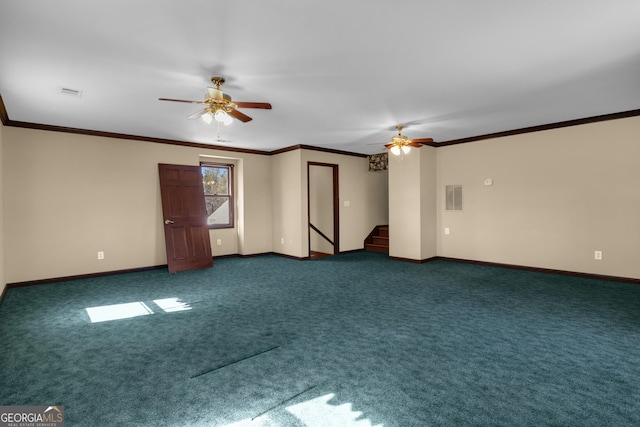 spare room with dark colored carpet, stairway, and ornamental molding