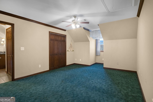 bonus room with baseboards, carpet floors, lofted ceiling, and a ceiling fan