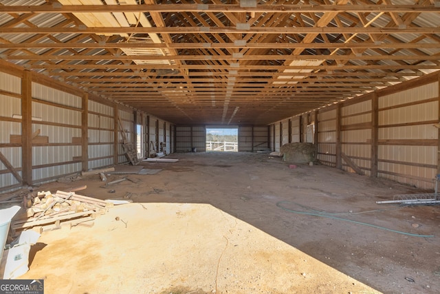 misc room with metal wall and lofted ceiling