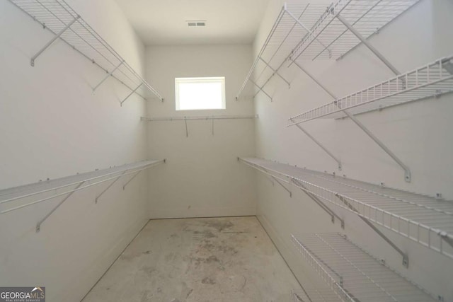 spacious closet featuring visible vents