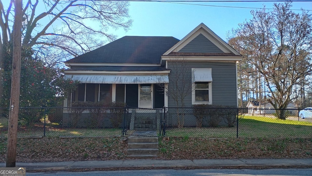 view of front of home with a gate and a fenced front yard