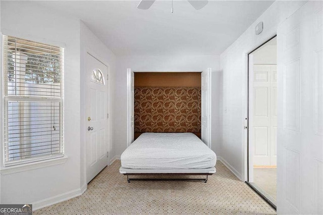 bedroom with baseboards and ceiling fan