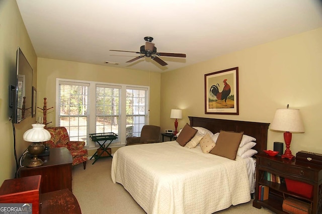 bedroom featuring visible vents, ceiling fan, and carpet floors