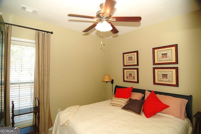 bedroom featuring a ceiling fan and visible vents