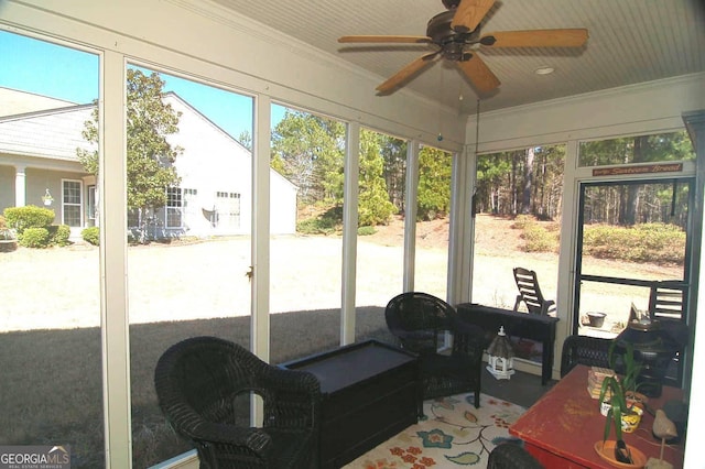 sunroom / solarium with ceiling fan