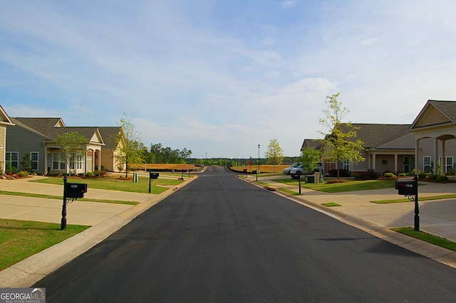 view of street featuring curbs and street lights