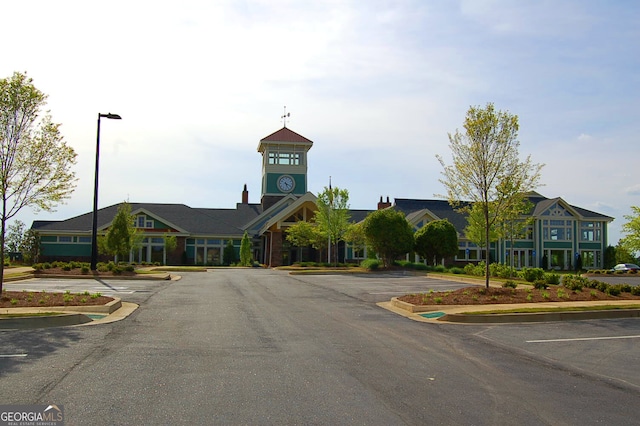 view of building exterior featuring uncovered parking