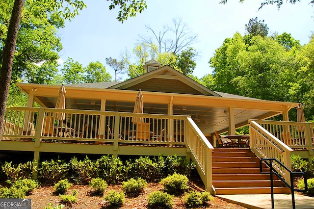 exterior space featuring a deck and stairway