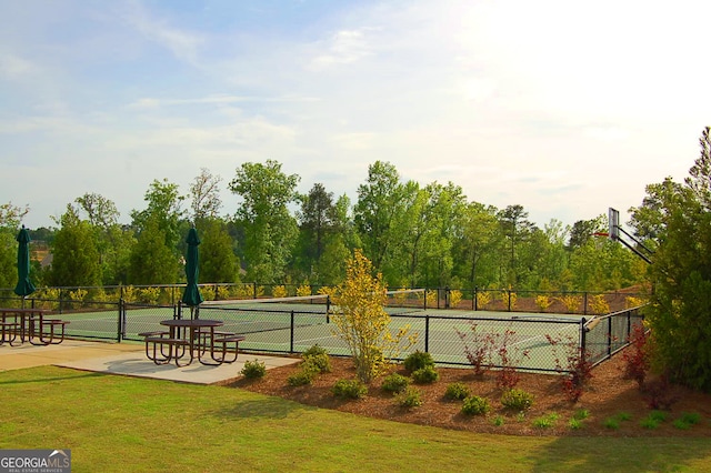 view of home's community with a yard and fence