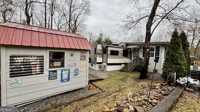 view of property exterior with metal roof