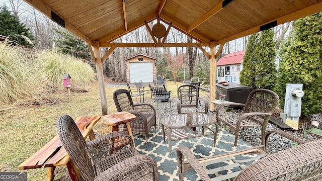 view of patio / terrace with a storage shed and an outdoor structure