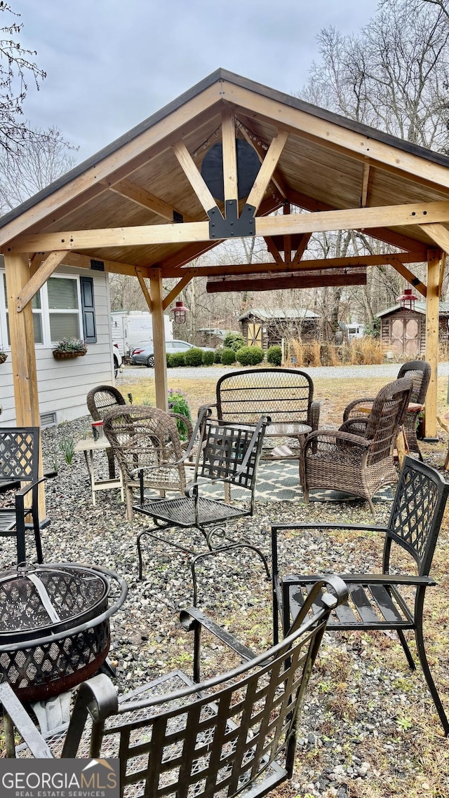 view of patio with a gazebo and an outdoor living space