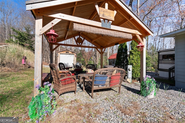 view of patio with an outbuilding and a gazebo