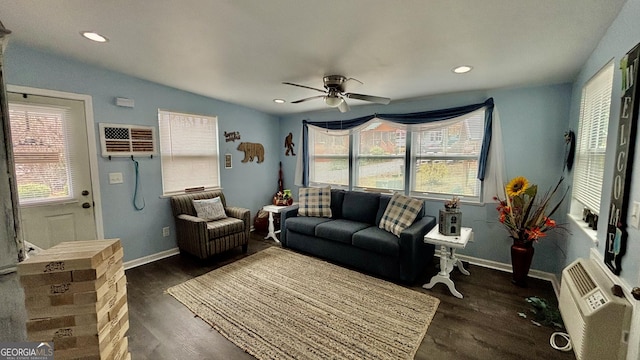 living room with ceiling fan, baseboards, an AC wall unit, recessed lighting, and dark wood-style flooring