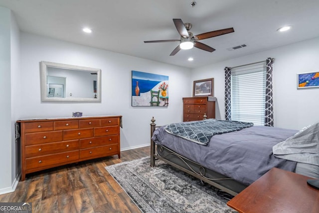 bedroom with a ceiling fan, wood finished floors, visible vents, baseboards, and recessed lighting