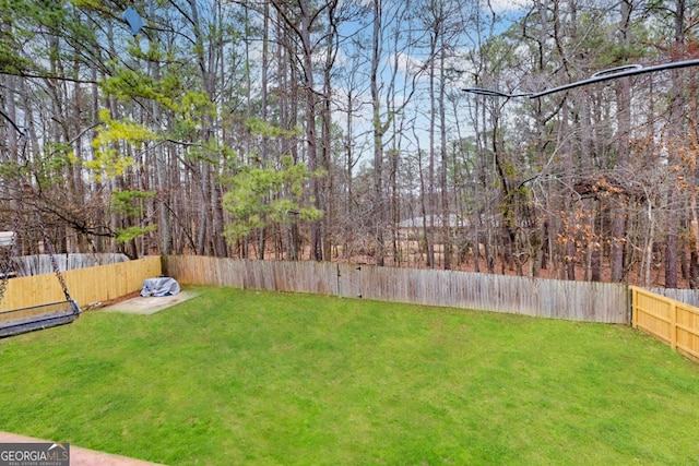 view of yard featuring a fenced backyard