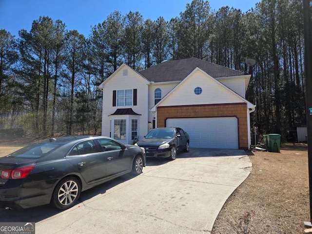 traditional-style house with an attached garage and driveway