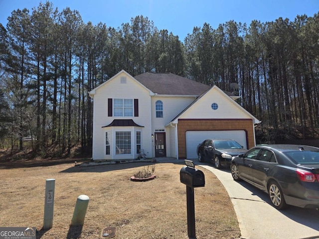 traditional home with driveway and an attached garage