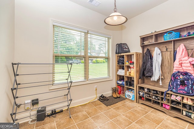 mudroom with baseboards, visible vents, and tile patterned floors