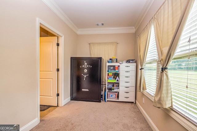 carpeted bedroom featuring crown molding, baseboards, and visible vents
