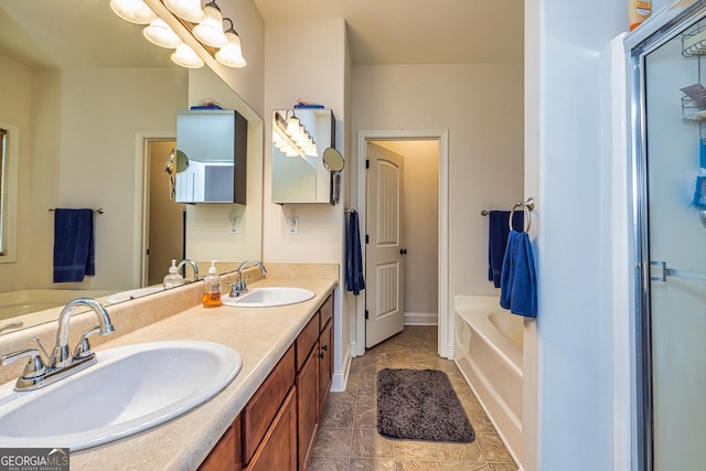 bathroom featuring a sink, double vanity, and a bath