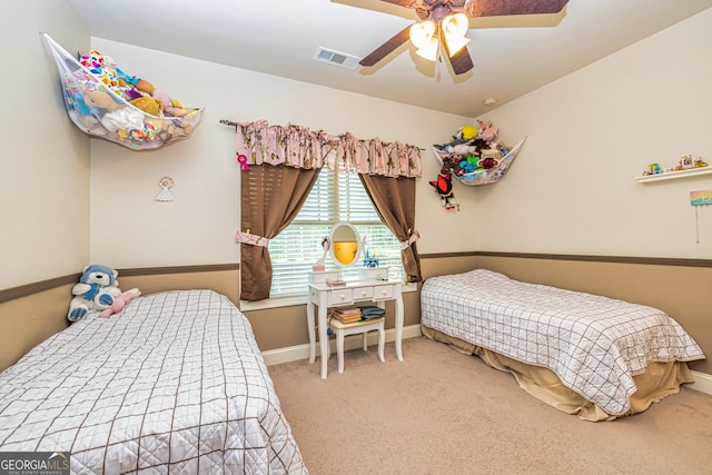 carpeted bedroom with baseboards, visible vents, and ceiling fan