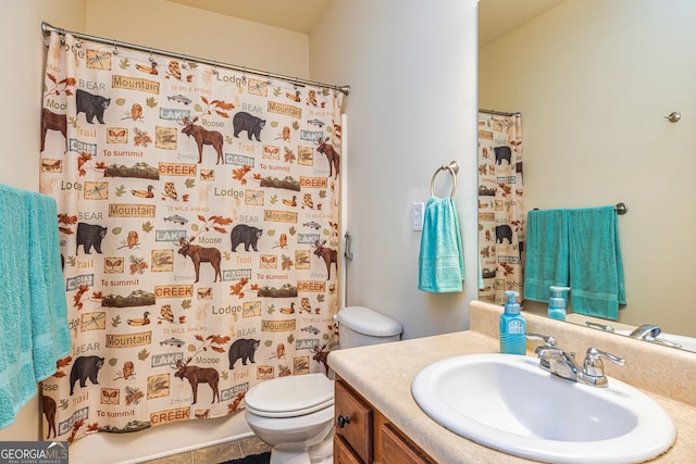 full bath with vanity, curtained shower, and toilet
