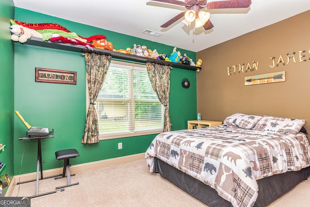 bedroom featuring visible vents, carpet flooring, baseboards, and a ceiling fan
