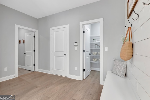 bedroom with baseboards and light wood-style floors