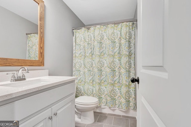 bathroom featuring tile patterned flooring, shower / bath combination with curtain, toilet, and vanity