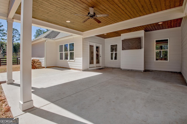 view of patio featuring ceiling fan and fence