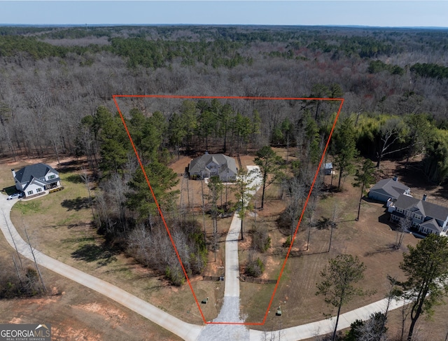 aerial view with a wooded view