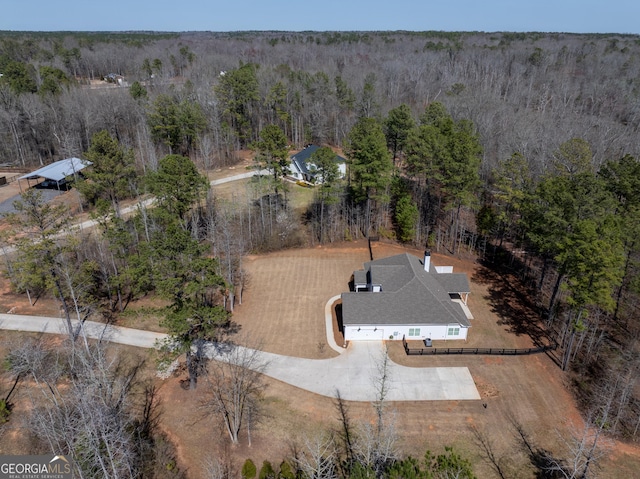 bird's eye view featuring a forest view