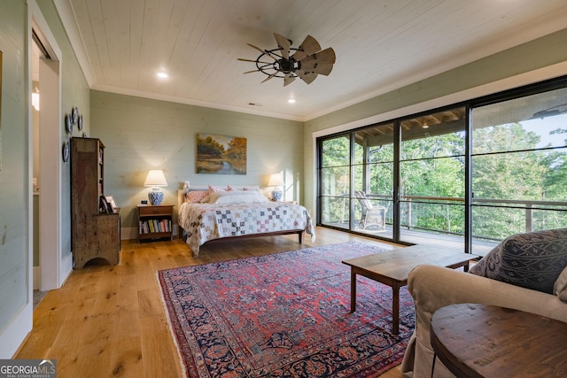 bedroom featuring access to exterior, light wood finished floors, wood ceiling, and ornamental molding