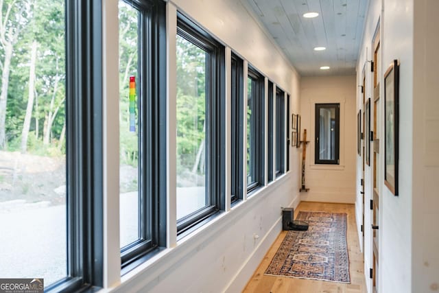 hallway featuring recessed lighting and wood finished floors