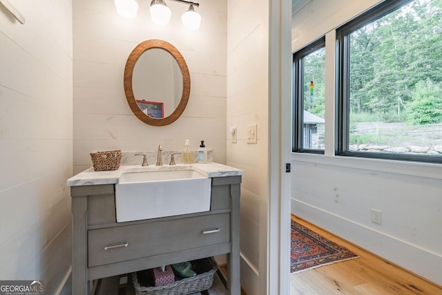 bathroom featuring vanity and wood finished floors