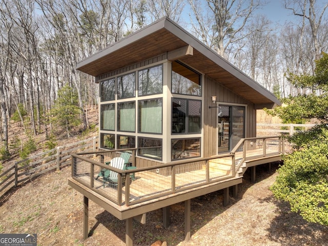 view of outbuilding with fence