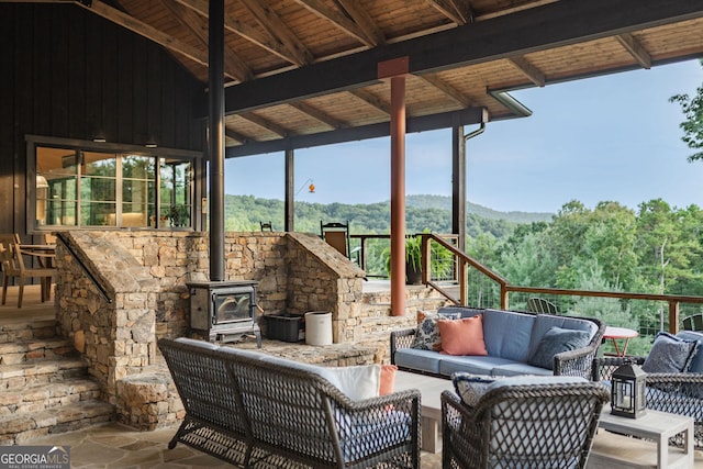 view of patio featuring an outdoor living space and a view of trees