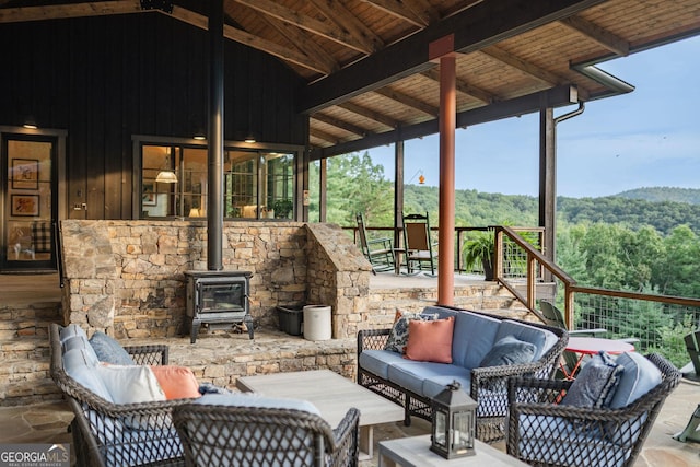 view of patio with a forest view and an outdoor hangout area