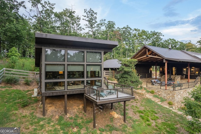 rear view of house with metal roof