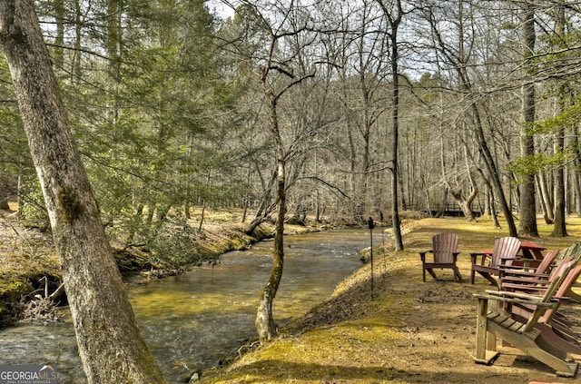 view of home's community with a view of trees