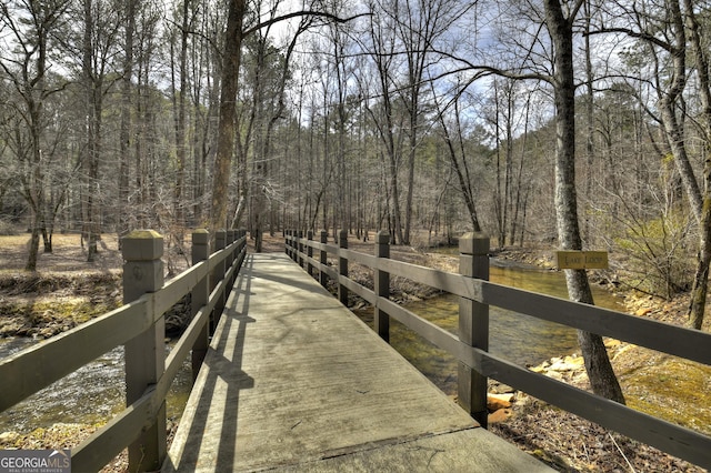 surrounding community featuring a wooded view